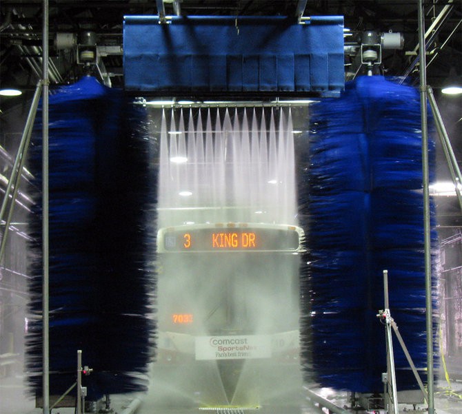 Bus in car wash tunnel