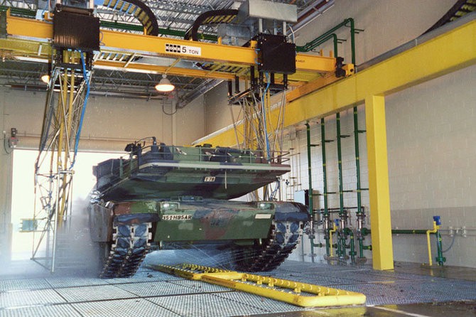 military vehicle in fleet wash tunnel