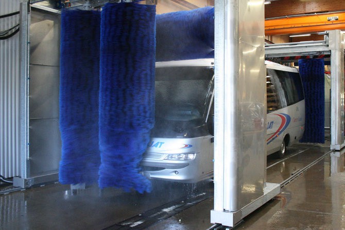 Bus in an industrial wash tunnel